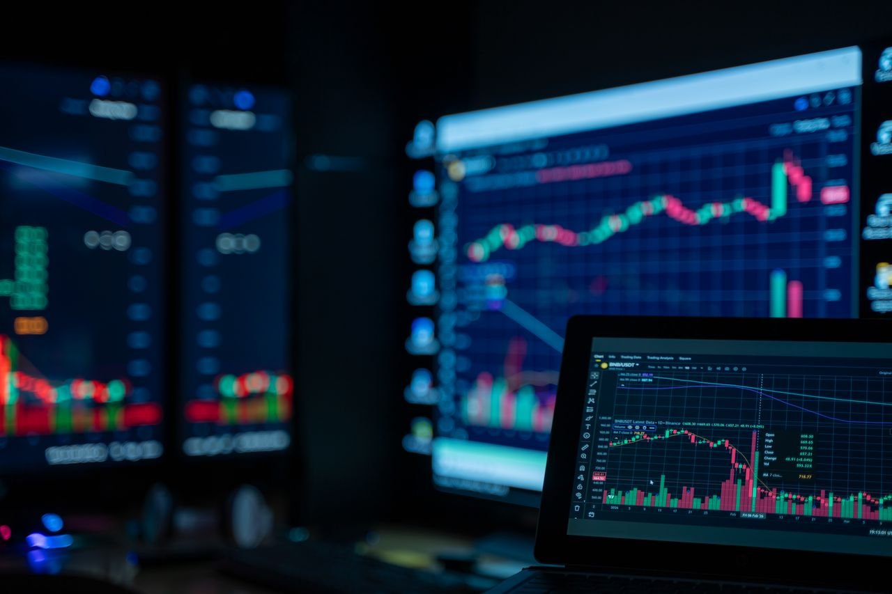 Crafting Captivating Headlines: Your awesome post title goes here Monitors displaying stock market charts in a dimly lit room, perfect for finance and trading themes.